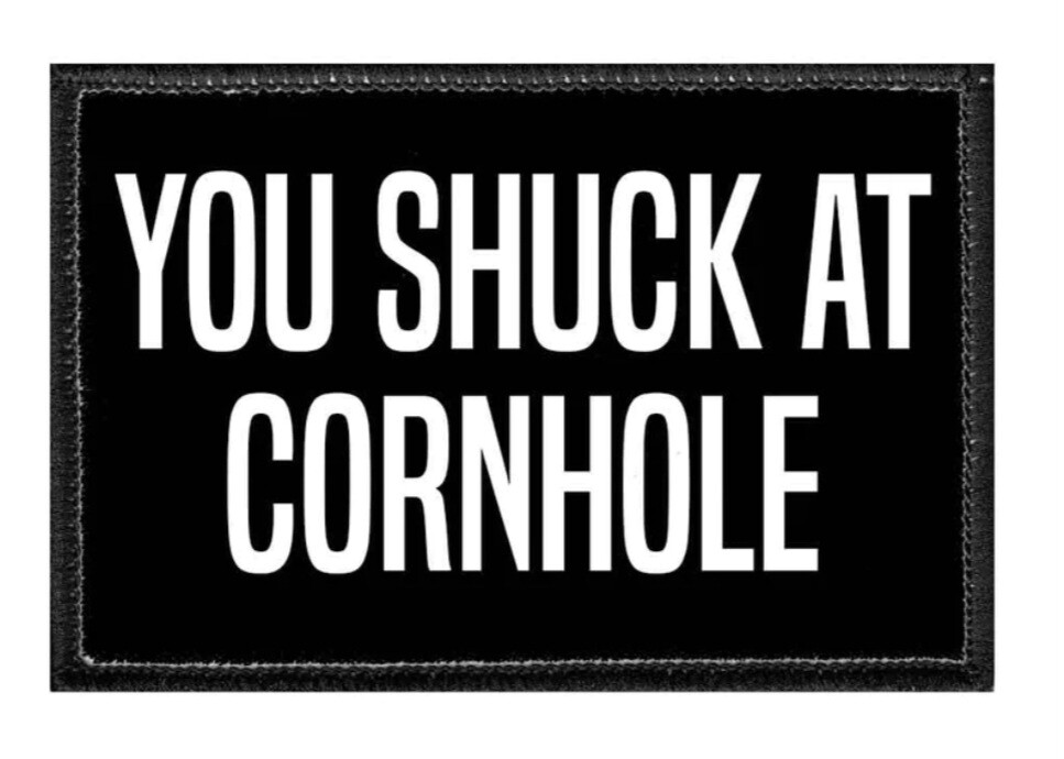 Patch-You shuck at cornhole