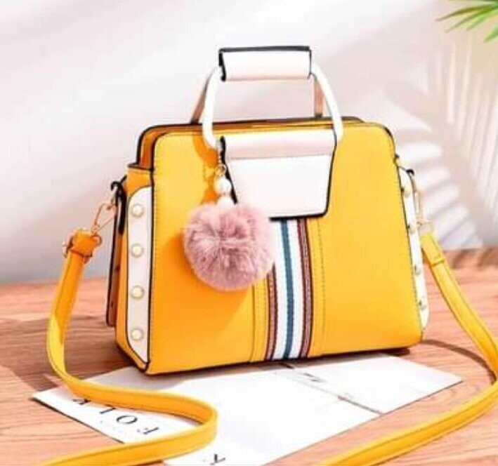 yellow leather bag with side pearls