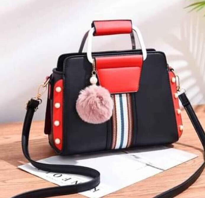 black leather bag with side pearls