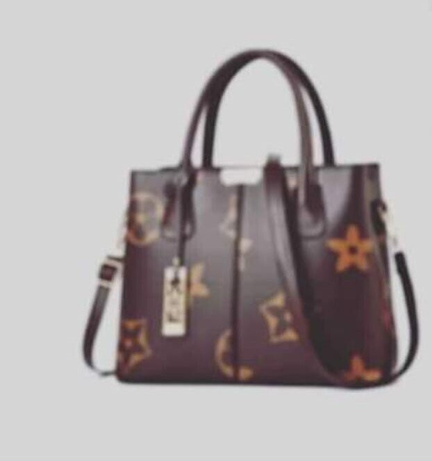black and brownish designed yel leather handbag