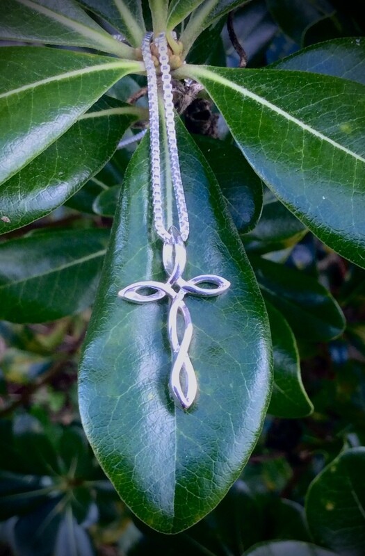 Sterling silver Twisted Knot Celtic Cross on Leaf