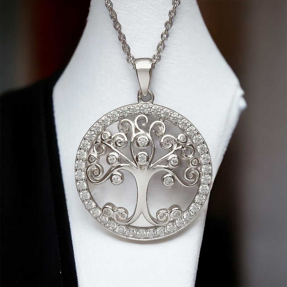 Magical Circular Tree of Life with CZ Stones Sterling silver Tree of Life pendant with sparkling clear CZ stones, handcrafted Celtic jewelry shown on jewelry holder.