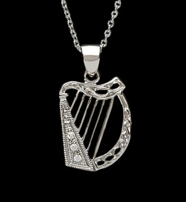 Delicate Harp with CZ Stones Celtic harp sterling silver pendant with CZ stones, traditional Irish jewelry and cultural symbol, shown on black background.