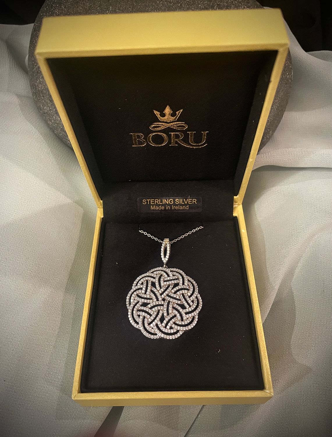 Celtic Knot pendant in sterling silver, adorned with cubic zirconia, elegant Celtic design necklace, in jewelry box. 