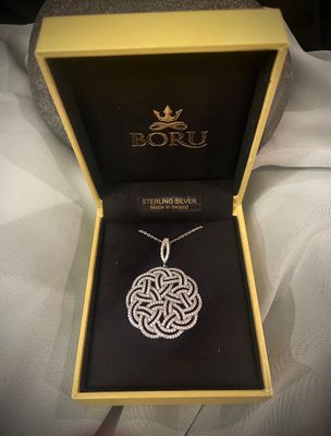 Celtic Knot pendant in sterling silver, adorned with cubic zirconia, elegant Celtic design necklace, in jewelry box. 