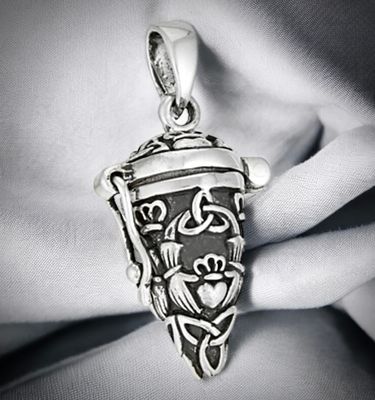 Sterling silver vial locket pendant necklace with Celtic trinity knot design, handcrafted jewelry, on grey fabric.