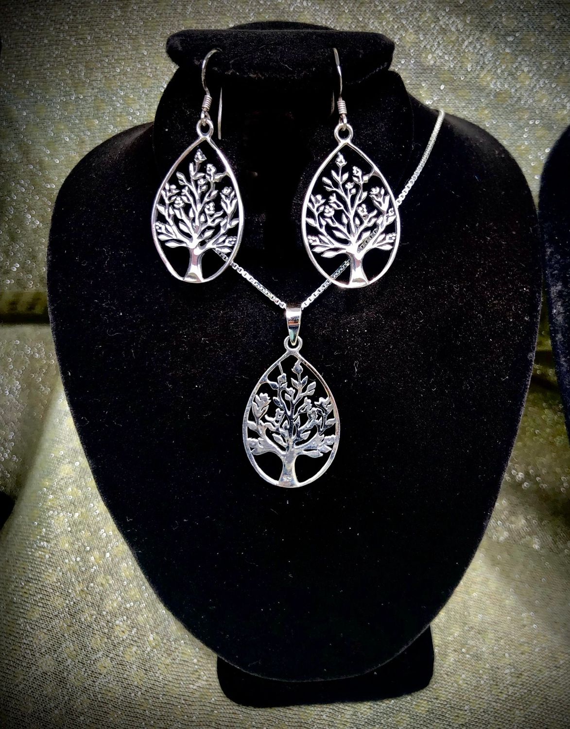 Sterling Silver Teardrop Celtic Tree of Life Drop Earrings and Pendant jewelry set, on jewelry holder.