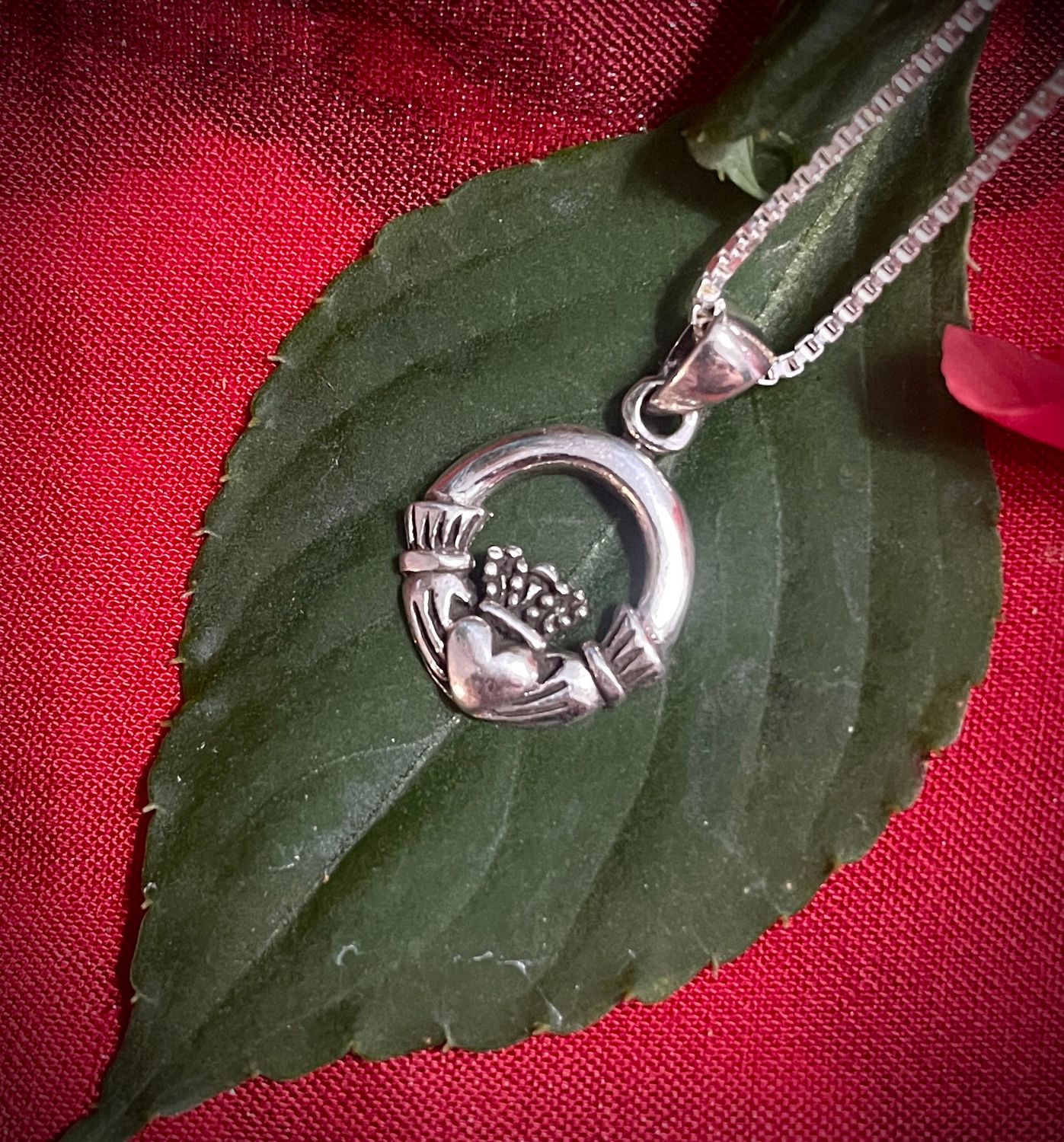Finely Detailed Small Silver Claddagh Pendant Celtic Sterling Silver Irish Claddagh Pendant Necklace on Leaf