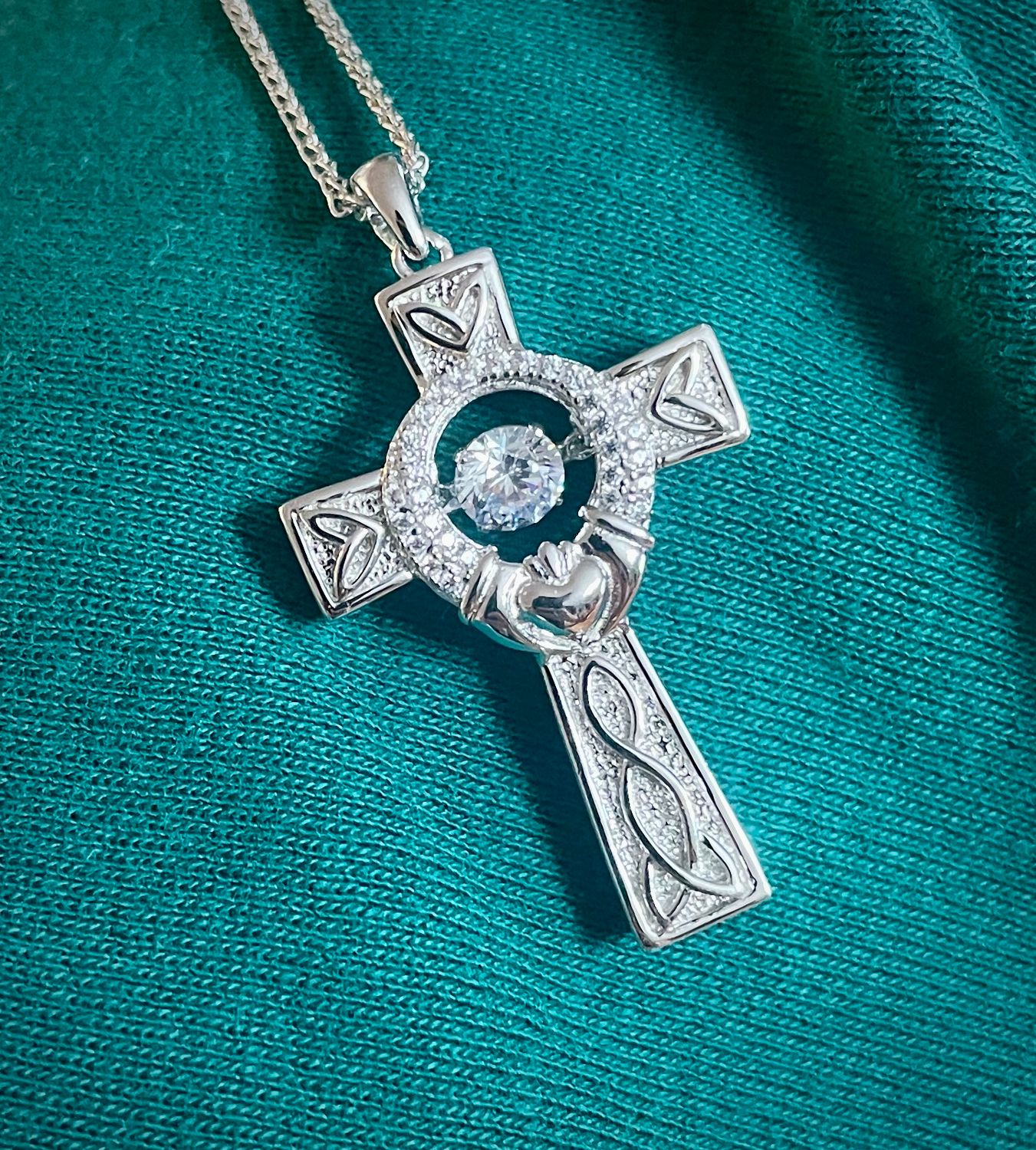 Silver Cross Dancing Stone and Claddagh Celtic knot cross necklace made in sterling silver with a sparkling CZ center, ideal Irish gift for heritage lovers.