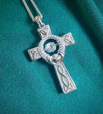 Celtic knot cross necklace made in sterling silver with a sparkling CZ center, ideal Irish gift for heritage lovers.