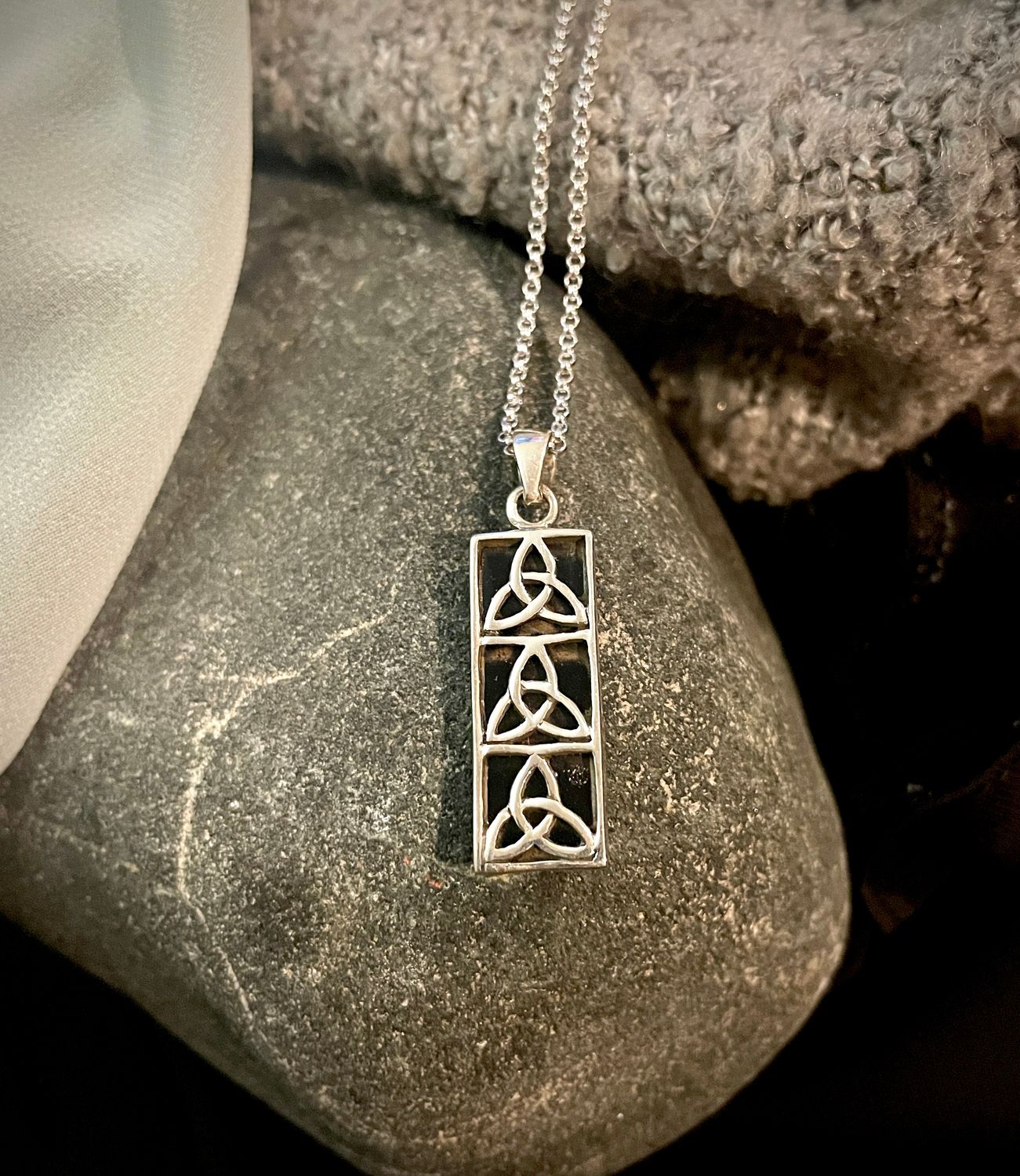 Three Vertical Trinity Knots
