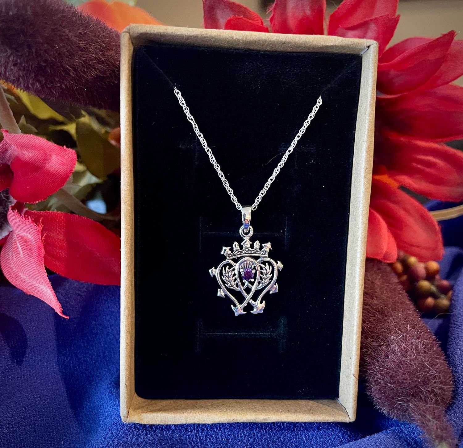 Scottish Luckenbooth pendant in sterling silver, traditional Celtic jewelry with symbolic meaning, shown in jewelry box. 
