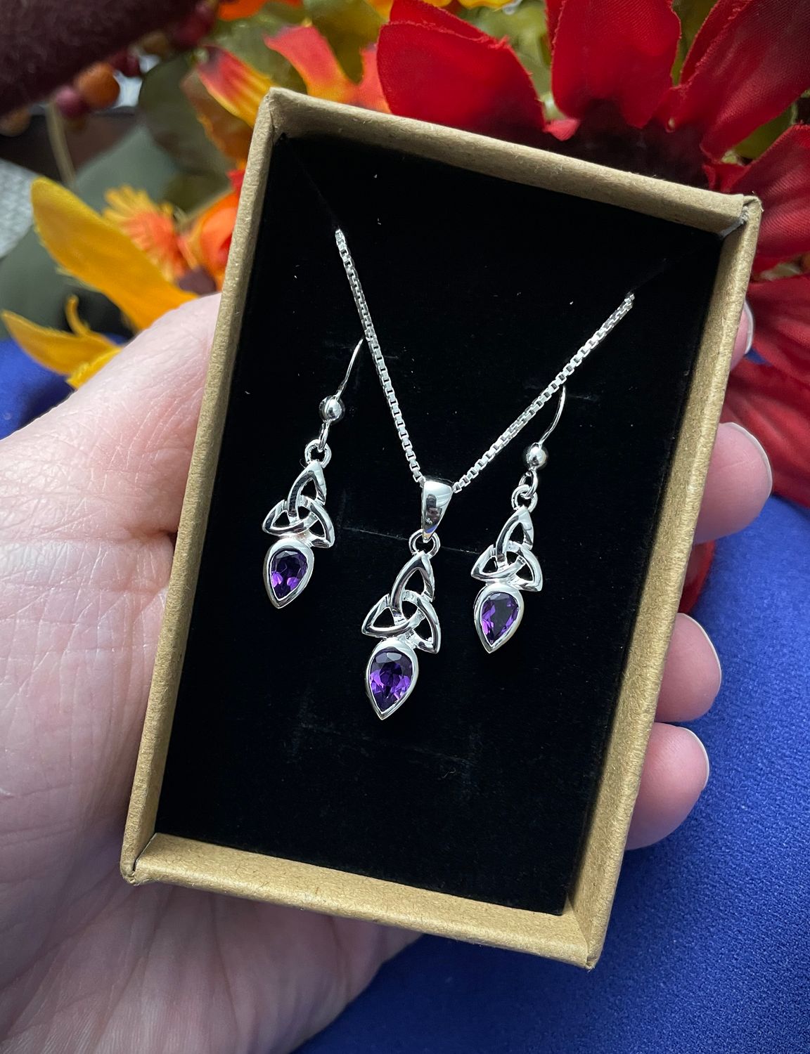 Sterling Silver Trinity Knot Celtic pendant with February amethyst birthstone, in jewelry box. 