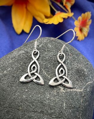 Sterling silver Celtic Motherhood Knot earrings on stone, symbolizing the eternal bond between mother and child.