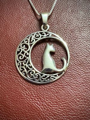 The Celtic Cat in Crescent Moon Knotwork Sterling silver Celtic moon pendant with intricate knotwork and a cat design, perfect for cat lovers or a memorial gift.