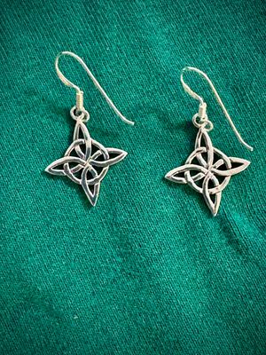 Sterling Silver Witch's Knot Hexefus Earrings on Green Fabric. 