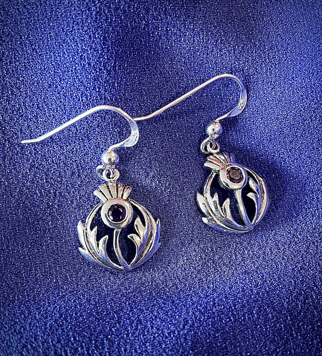 Sterling silver Scottish thistle earrings with central amethyst CZ stone, celebrating Scottish and Celtic heritage.