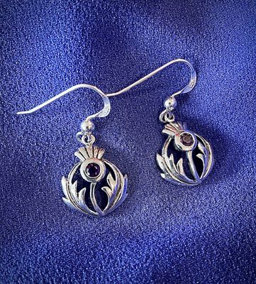 Sterling silver Scottish thistle earrings with central amethyst CZ stone, celebrating Scottish and Celtic heritage.