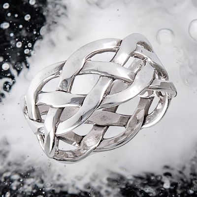 Celtic Weave Ring Sterling silver Celtic weave ring with intricate knotwork, elegant and inspired by Celtic heritage. On Water background.