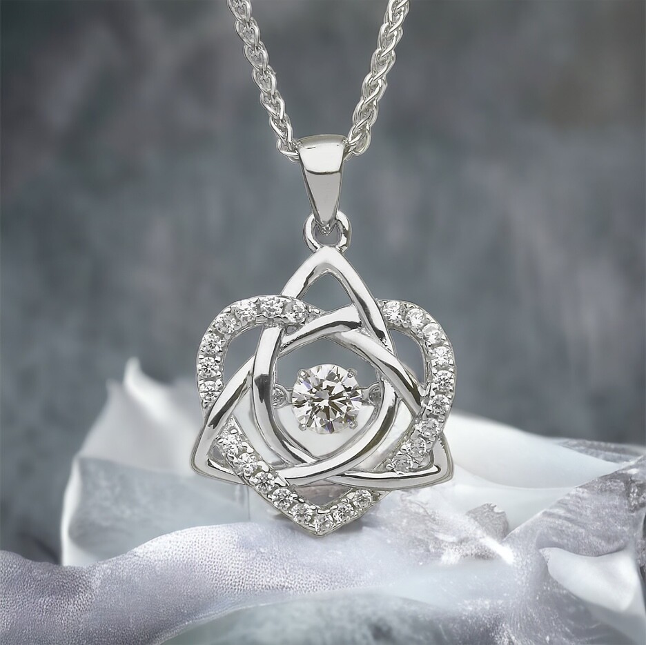 Silver Pendant Dancing Stone - Trinity and Heart Sterling silver Celtic trinity knot and heart pendant with central dancing CZ stone, handcrafted in Ireland.