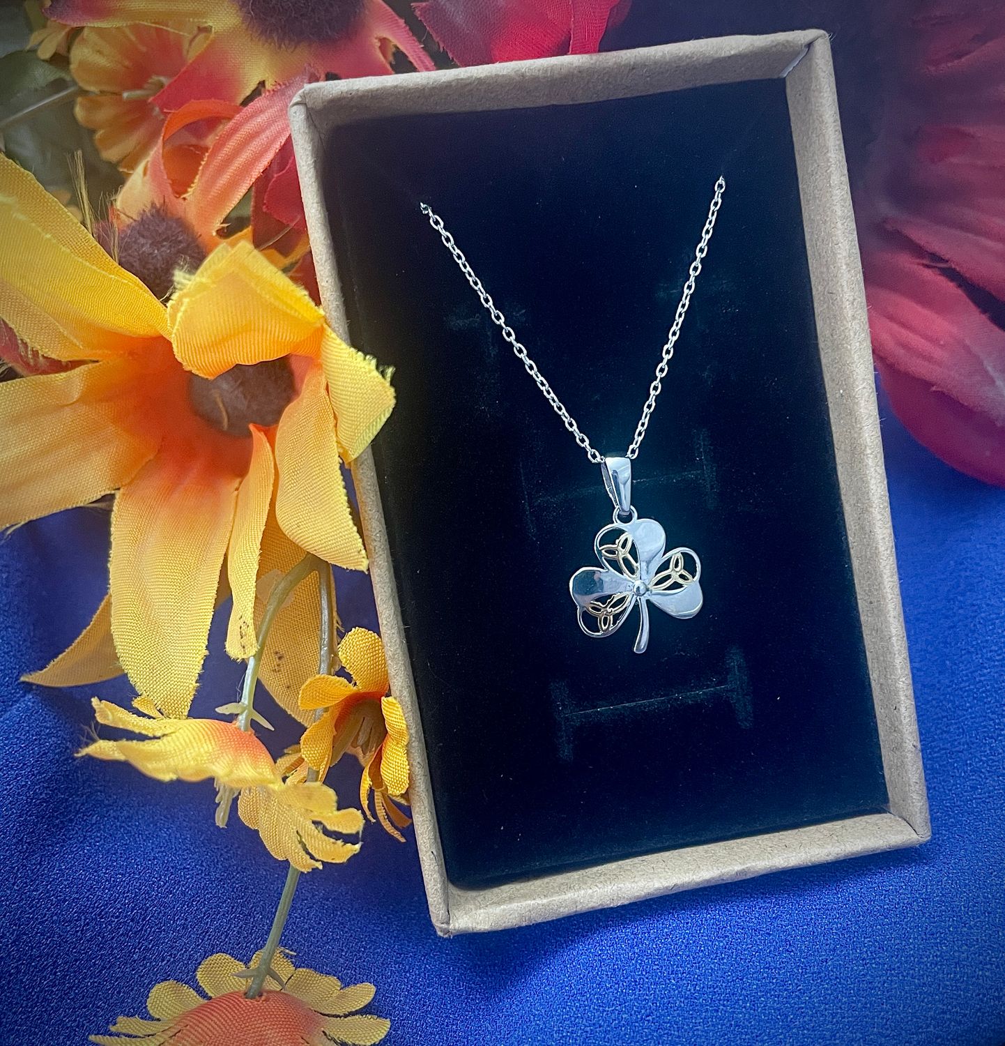 Shamrock with Yellow Trinity Knot Sterling silver Shamrock pendant featuring three yellow gold plated Trinity knots, inspired by Irish heritage, in jewelry box