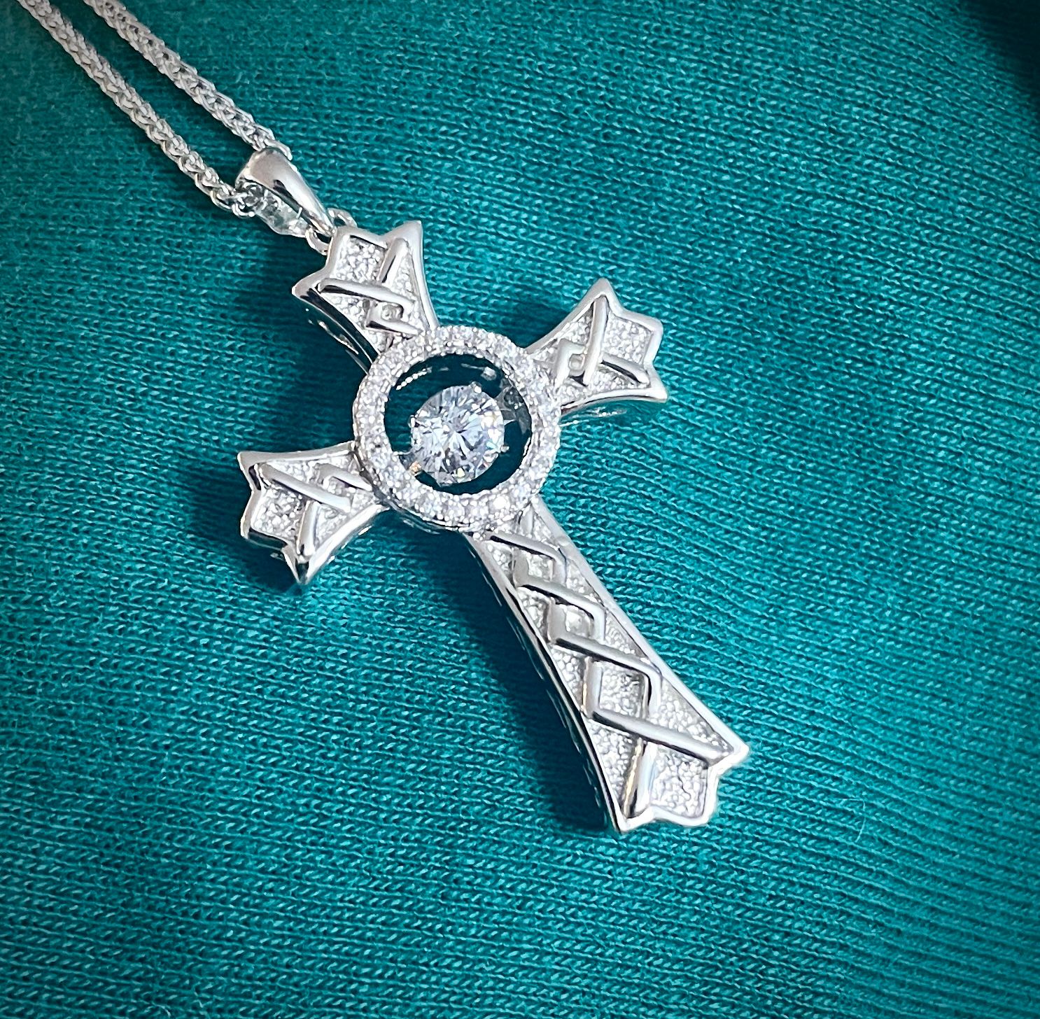 Silver Cross Dancing Stone Pointed High-quality sterling silver cross necklace featuring Celtic knot design and sparkling central CZ stone, perfect gift.