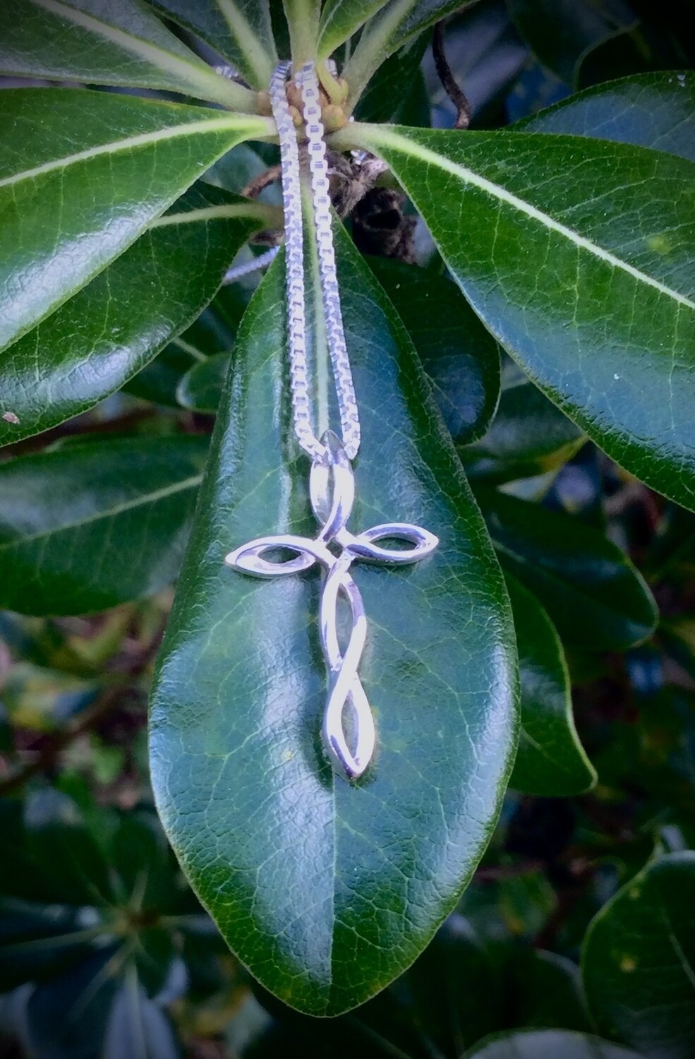 Twisted Knot Celtic Cross Pendant Sterling silver Twisted Knot Celtic Cross on Leaf