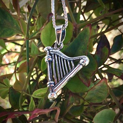 The Celtic Harp, Two-Sided Sterling Silver Irish Harp Pendant Necklace Near Leaves
