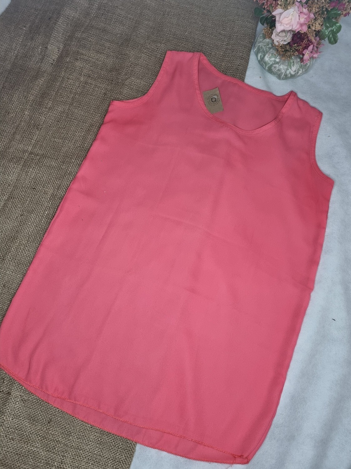 BLUSA SIN MANGAS DE GASA ROSA CHICLE, TRANSPARENTE