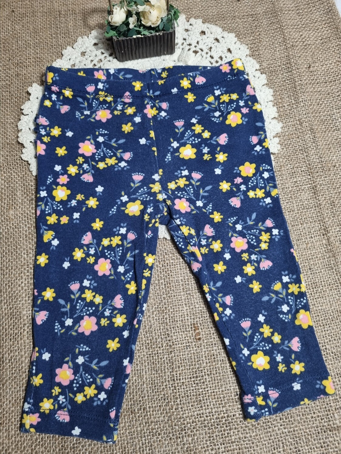 PELELE PARA BEBE 6 MESES. AZUL CON FLORES Y VOLADOS EN LA COLA. MARCA CARTERS