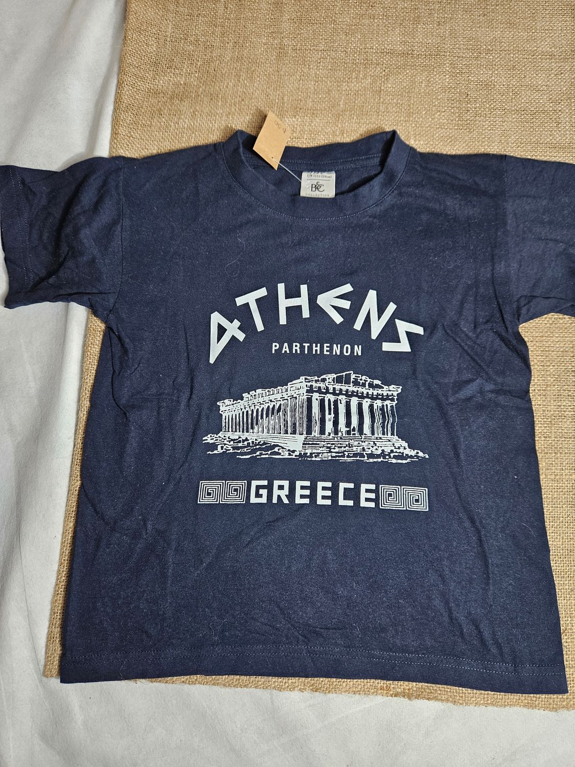 REMERA DE ALGODÓN, PARA NIÑO, MANGA CORTA, DISEÑO ATHENAS. COLOR NEGRO, TALLE 7/8 (CHICO)