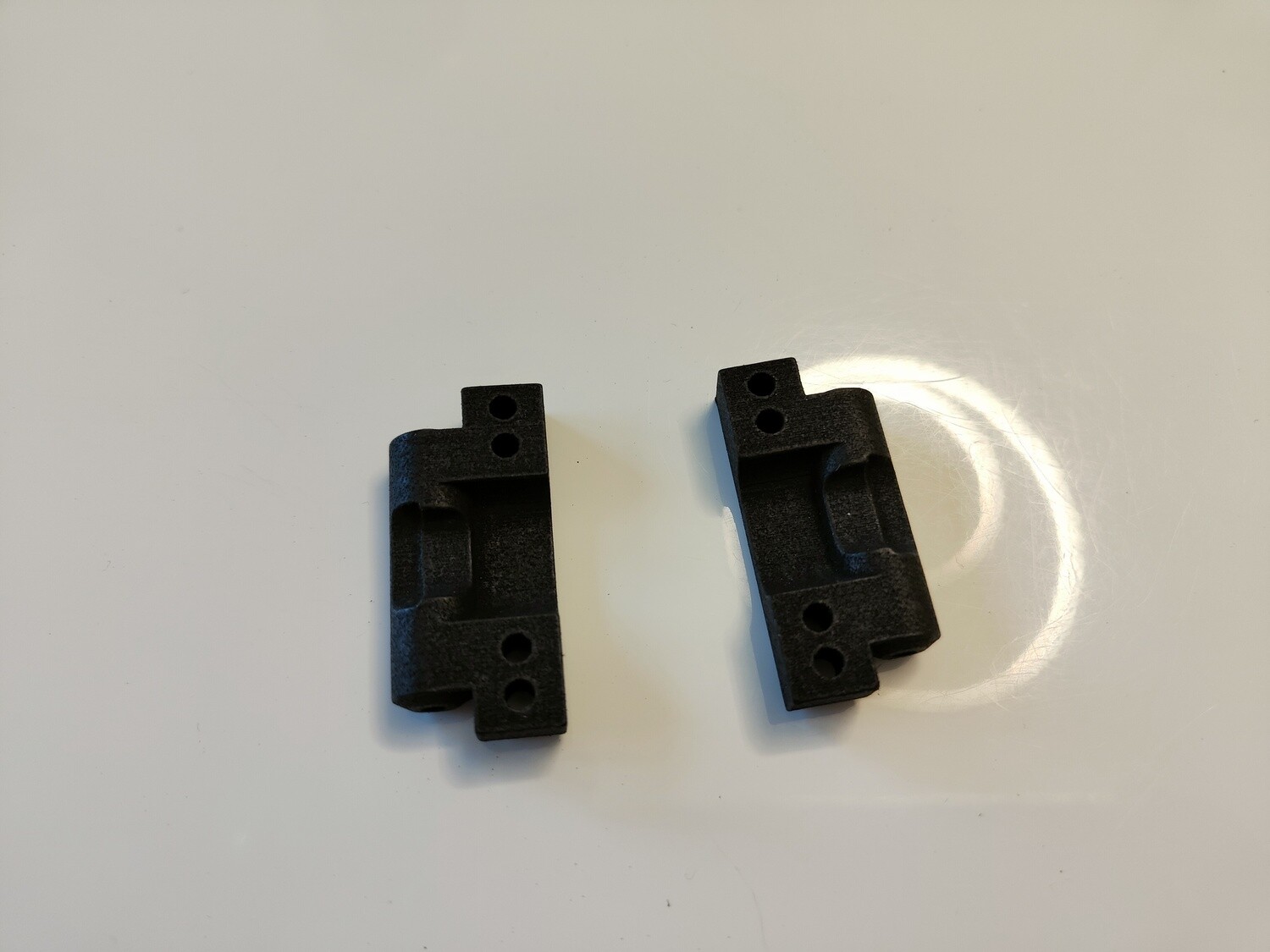 Team Associated RC10 rear arm mounts 2° toe (pair)