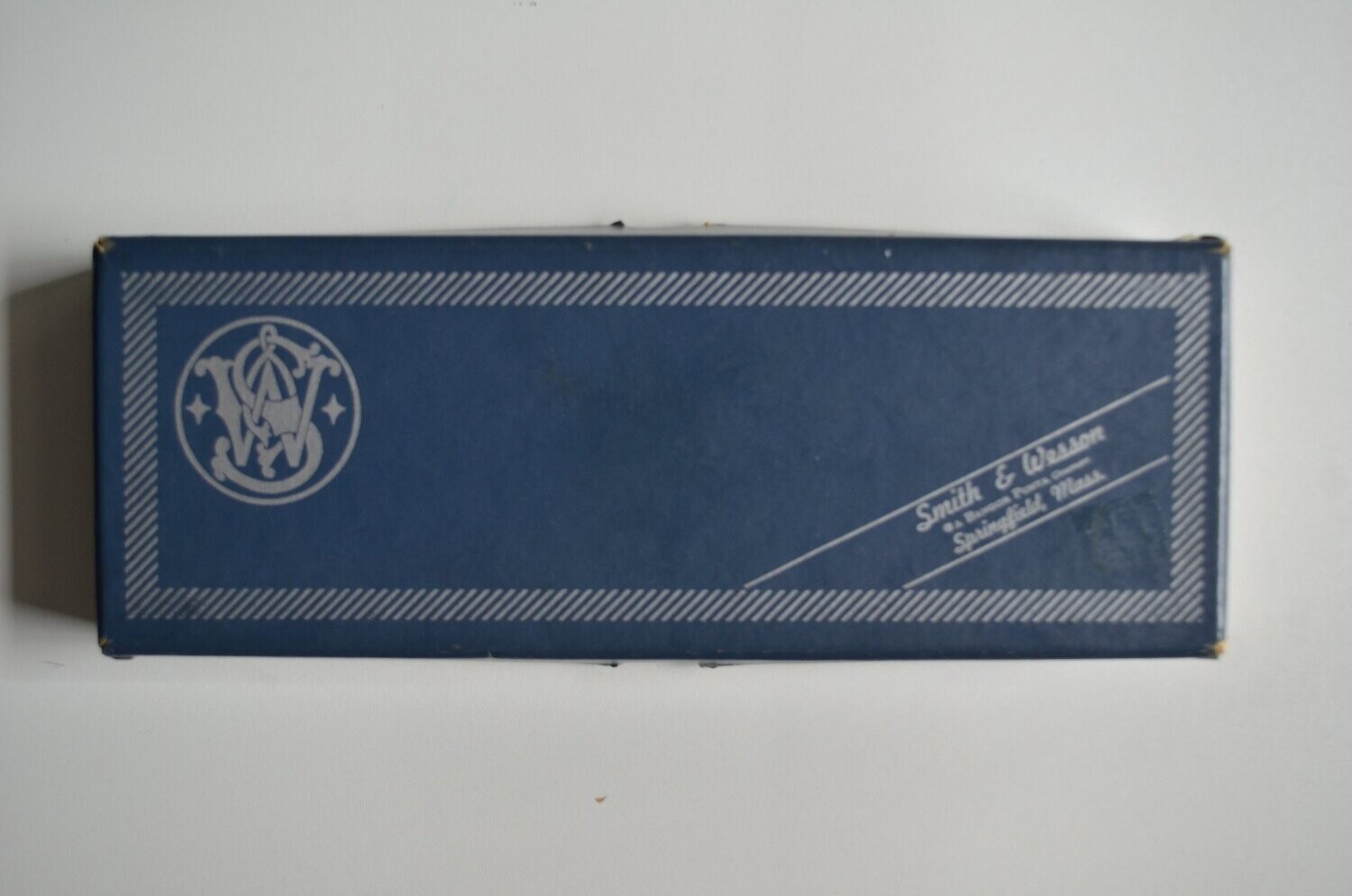 S&W	two-piece blue box with metal reinforced corner