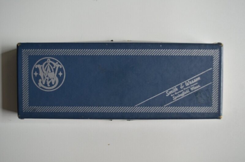 S&W	two-piece blue box with metal reinforced corner