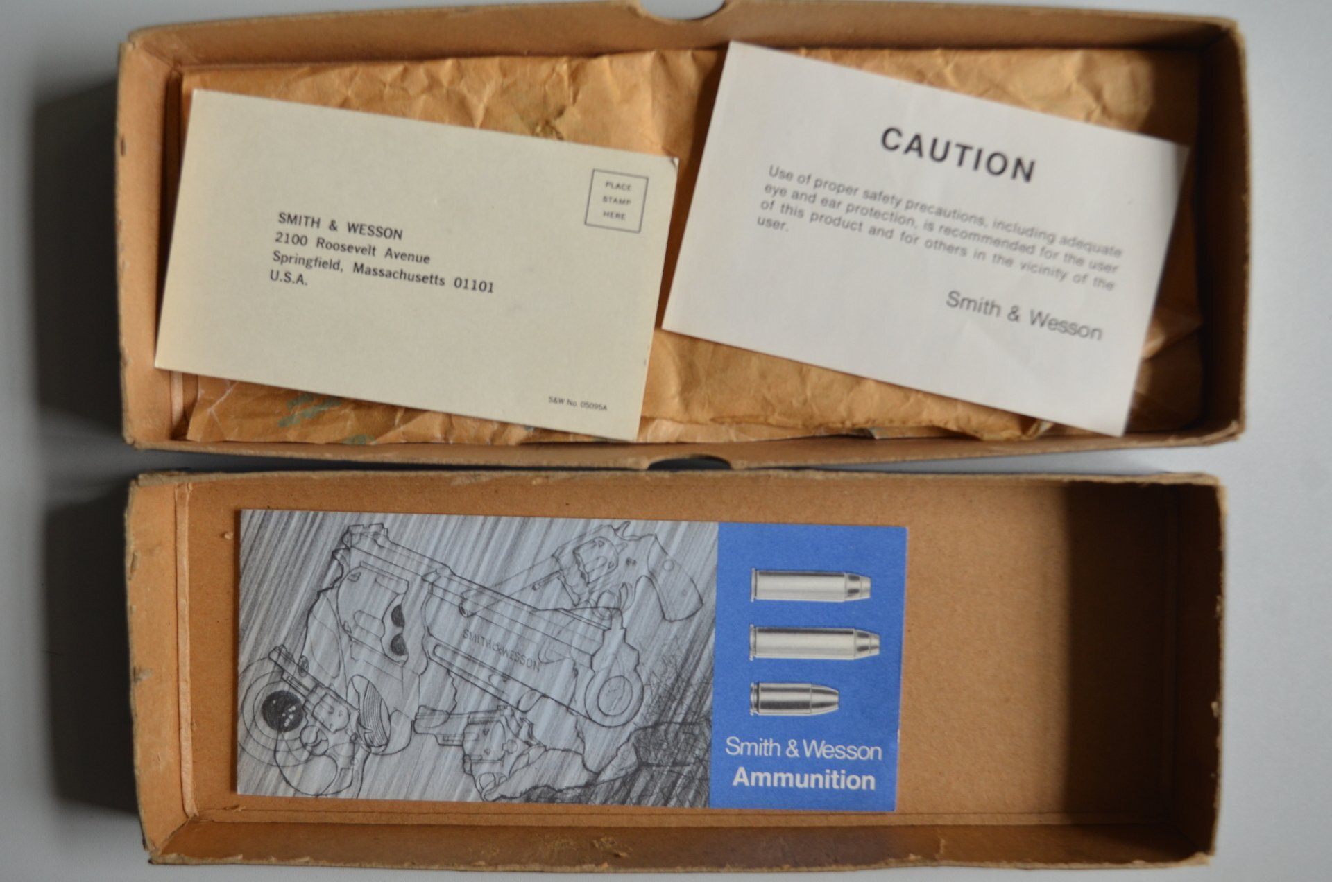 S&W	two-piece blue box with metal reinforced corner