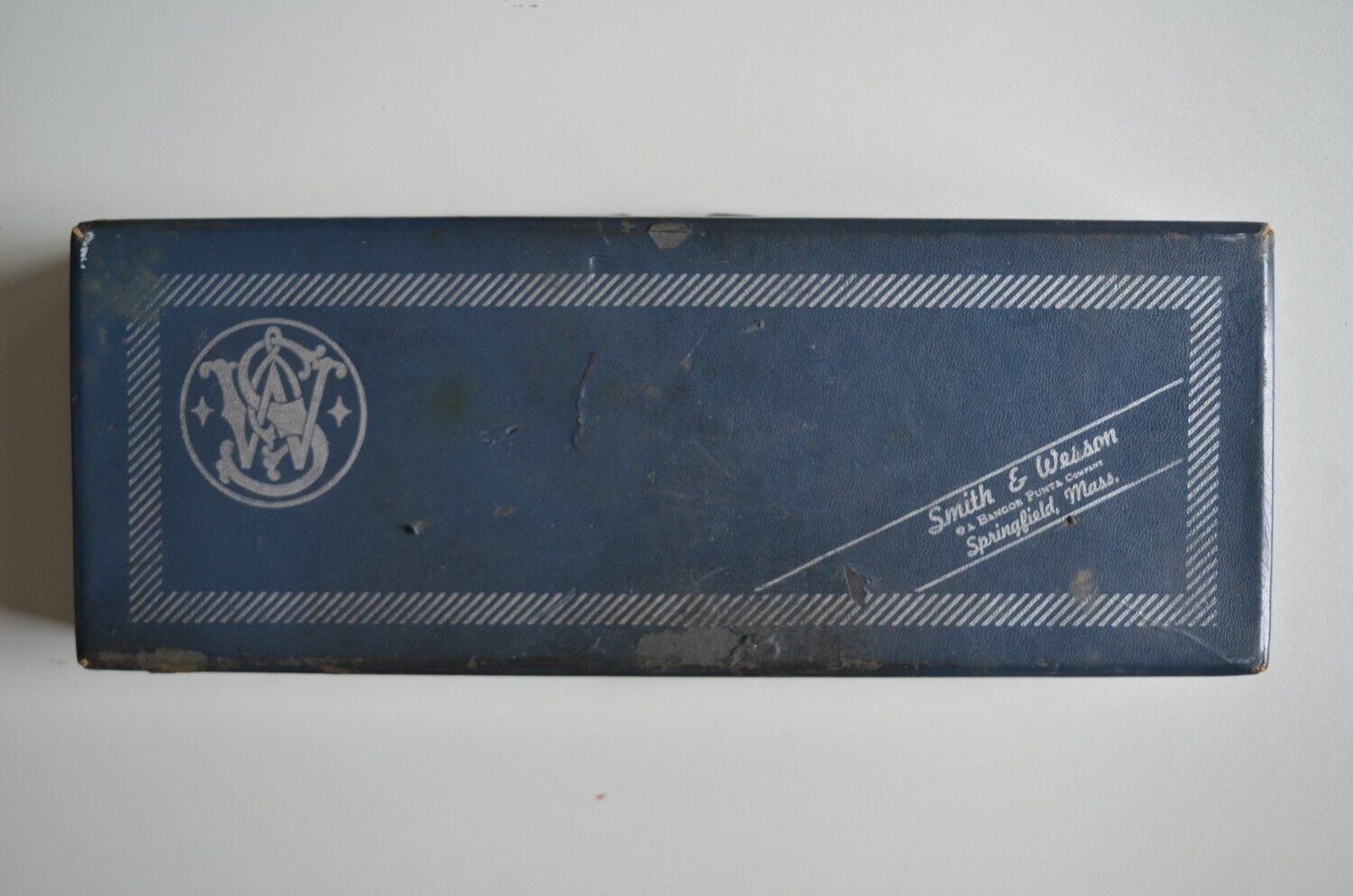 S&W	two-piece blue box with metal reinforced corner