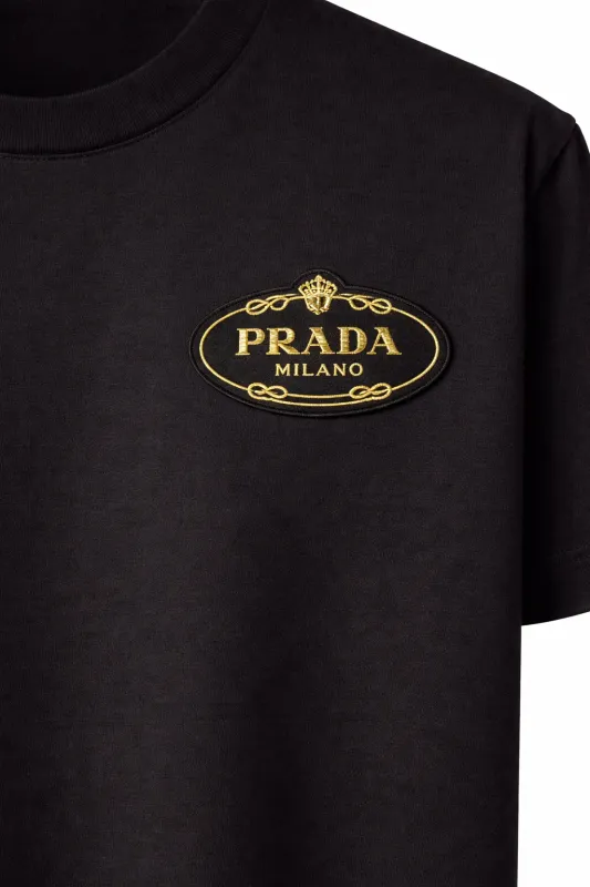 Prada logo gold embroidered black tshirt men close up luxury designer cotton detail