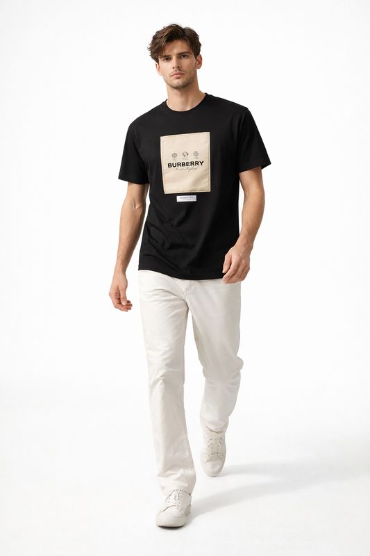 Burberry black logo patch men's t-shirt worn by male model walking pose luxury designer outfit