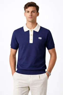 Valentino navy blue knit polo shirt on male model front straight pose studio shot