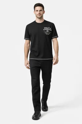 male model walking wearing Dolce &amp; Gabbana black designer t shirt luxury mens fashion outfit

