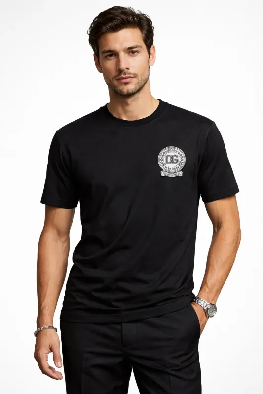 male model wearing Dolce &amp; Gabbana black DG crest logo designer t shirt luxury menswear fashion
