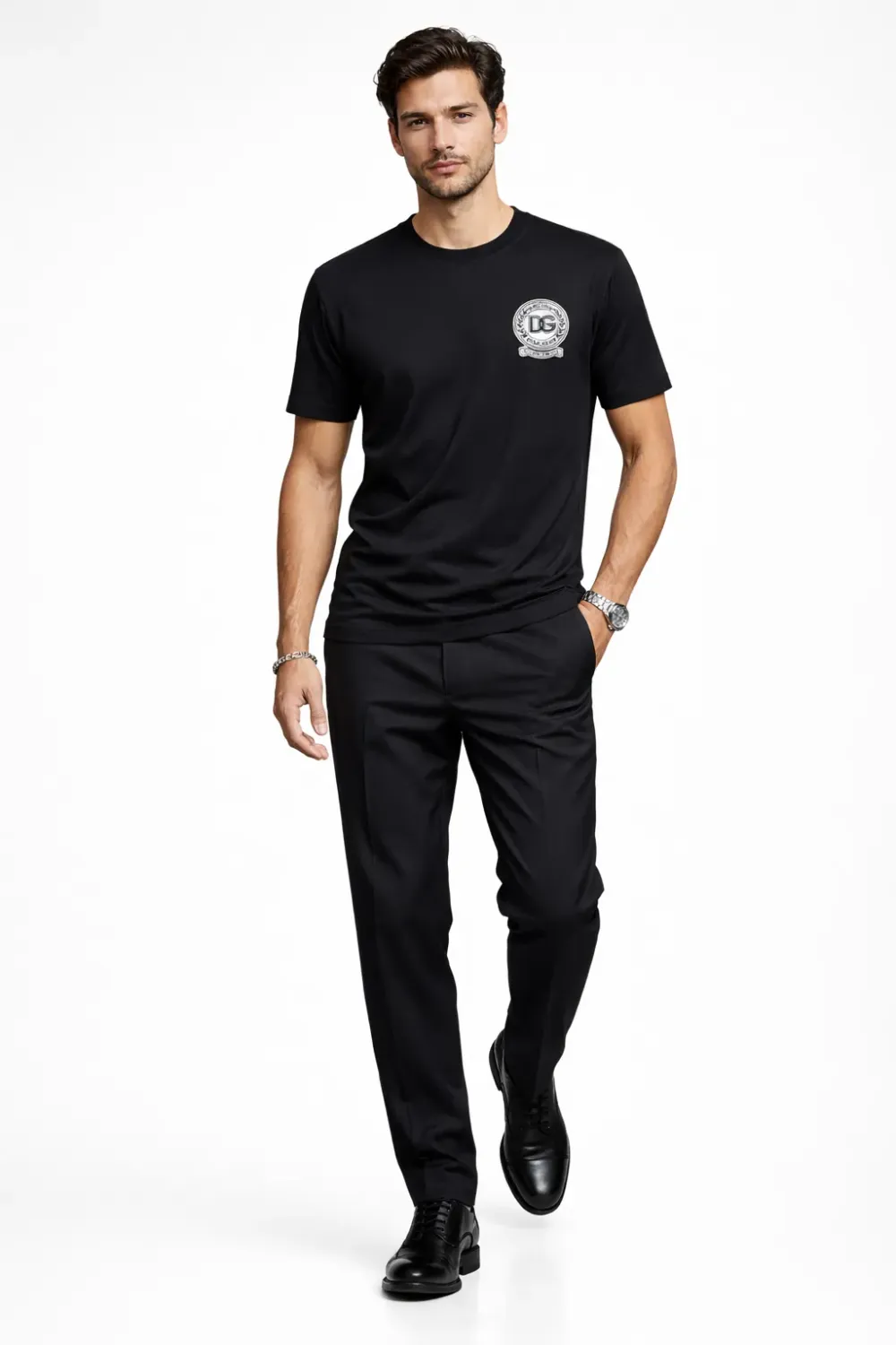 male model walking wearing Dolce &amp; Gabbana black DG crest designer t shirt luxury menswear fashion outfit
