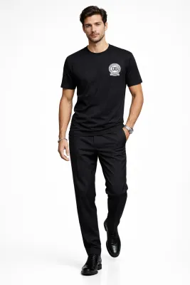 male model walking wearing Dolce &amp; Gabbana black DG crest designer t shirt luxury menswear fashion outfit
