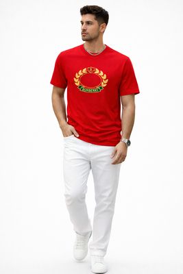 Male model walking while wearing Burberry red luxury t-shirt with embroidered logo in studio fashion photoshoot