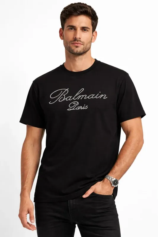 Balmain Paris men’s black T-shirt worn by model showing regular fit and luxury style