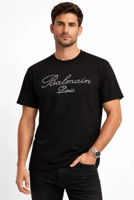 Balmain Paris men’s black T-shirt worn by model showing regular fit and luxury style