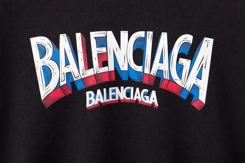 Balenciaga logo close-up detail on black designer t-shirt luxury men’s fashion product image