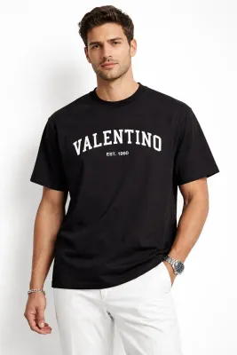 Valentino black mens tees on male model front straight pose studio shot