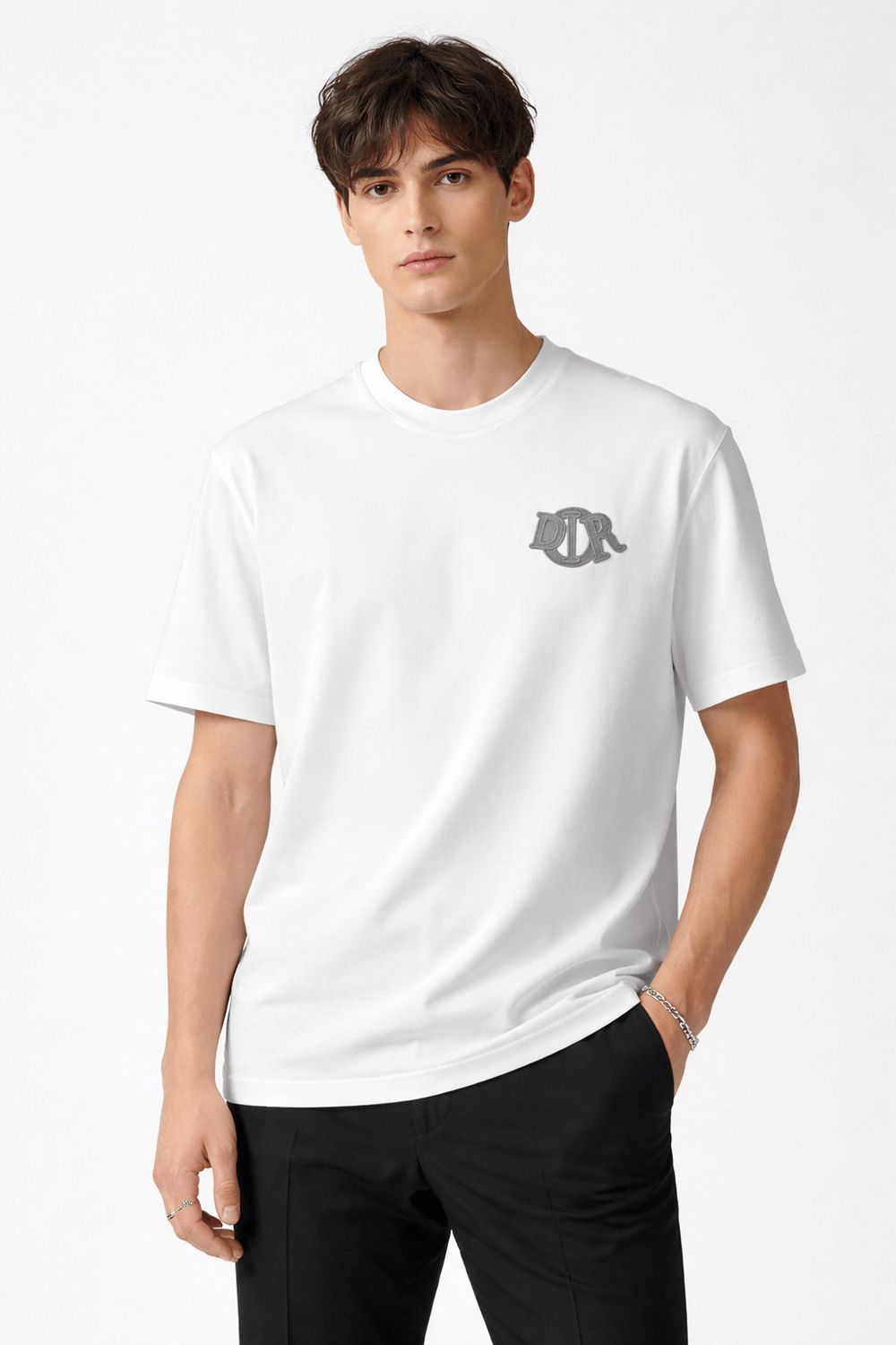 Male model wearing white Dior designer T shirt with embroidered logo luxury mens fashion style