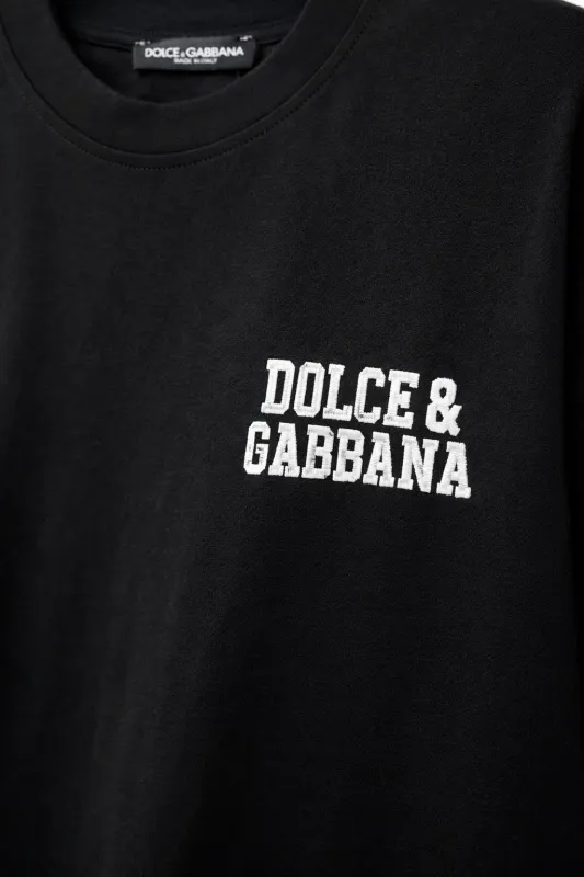 Dolce &amp; Gabbana embroidered chest logo close-up on black luxury men's designer t-shirt